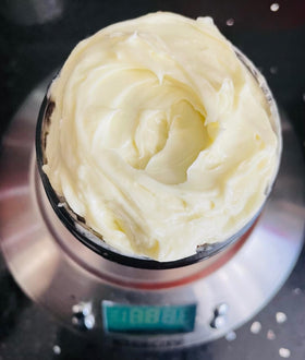 Oslove Organics closeup of mango butter texture revealing creamy granules