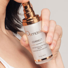 OSMOSIS bottle next to coin for scale showing one fluid ounce travel-friendly benefit