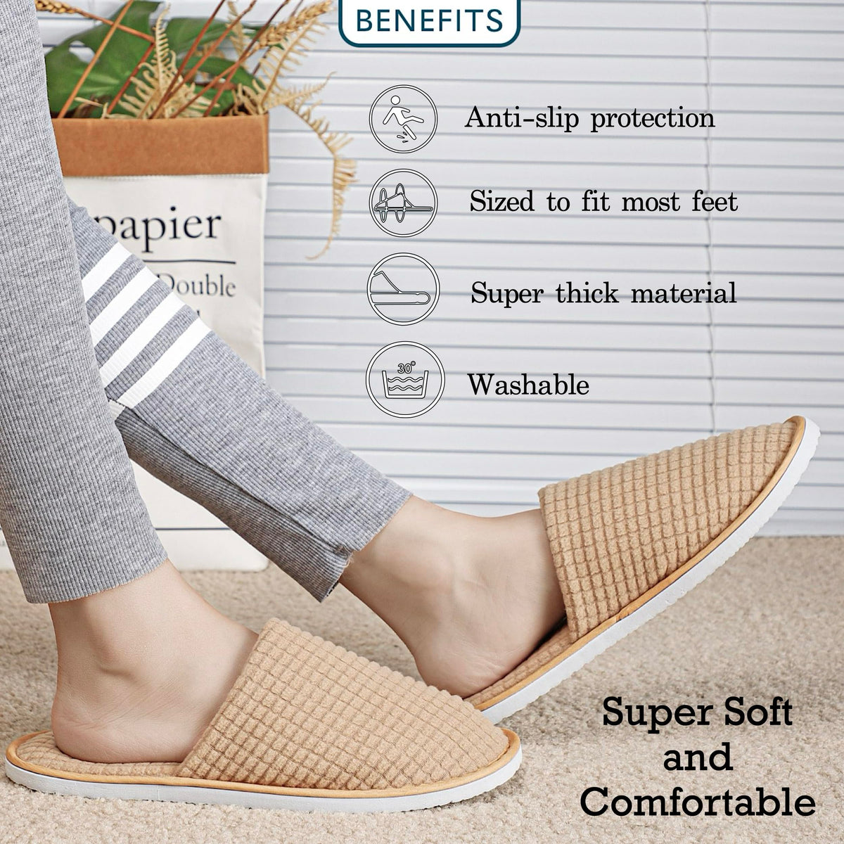 OSTADARRA hand holding slipper to show scale and one-size-fits-most fit