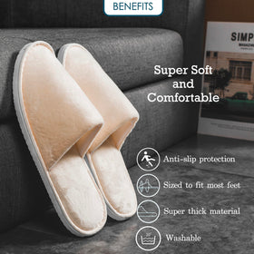 OSTADARRA slippers held in hand for scale showing compact lightweight benefit