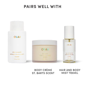 OUAI bottle held in hand for scale, travel-friendly 10 fl oz size shown