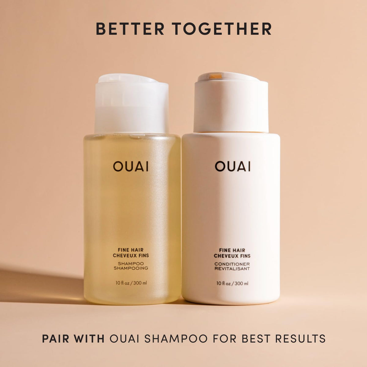 OUAI applying conditioner to mid-lengths for easier detangling