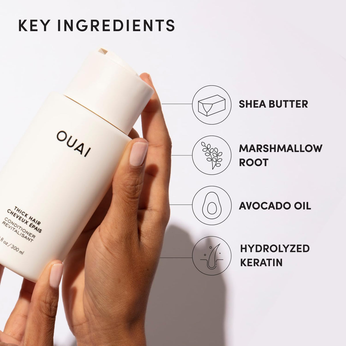 OUAI conditioner being applied in shower demonstrating quick detangling benefit