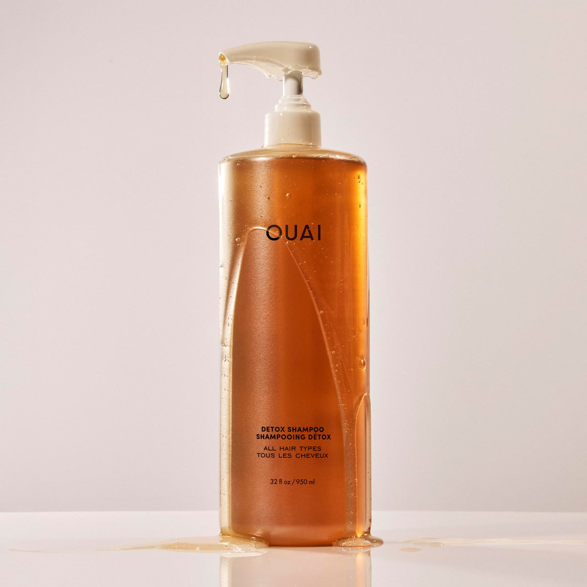 OUAI detox shampoo pump and label highlighting ingredients and easy dispensing benefit