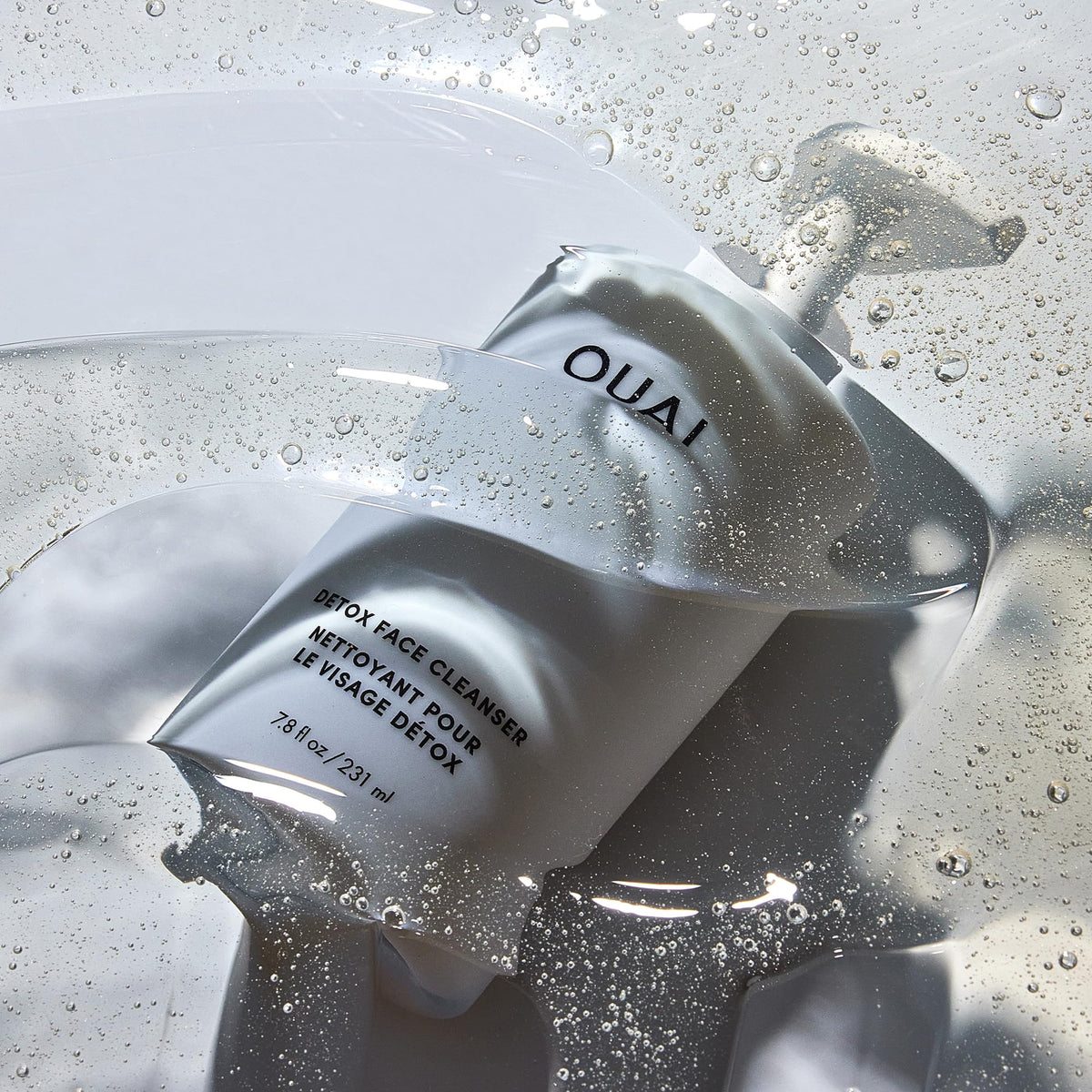 OUAI detox next to ruler shows the 7.8 fl oz size and travel readiness