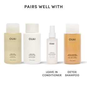 OUAI conditioner being applied to lengths showing detangling and smoothness