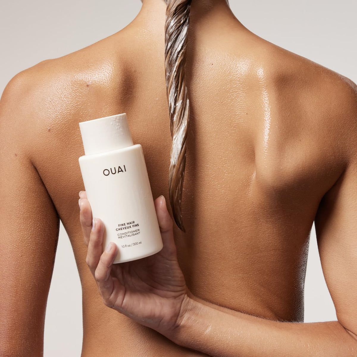 OUAI ingredient label with keratin and biotin callouts for strength