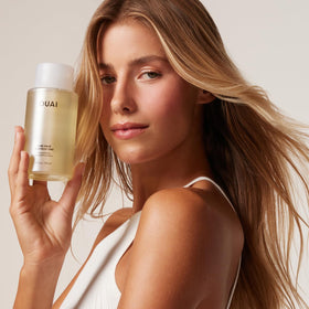 OUAI pump dispensing shampoo foam demonstrating lightweight lather and volume