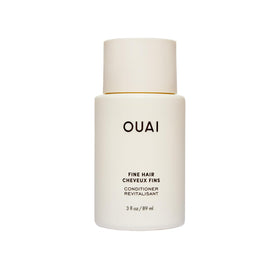 OUAI front packaging showing travel-size conditioner and portability benefit
