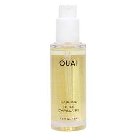 OUAI bottle front view showing label and compact travel size benefit