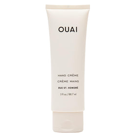 OUAI hand cream front tube showing packaging and benefit of portable hydration