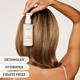 OUAI spray being applied to damp curly hair, reduces tangles quickly