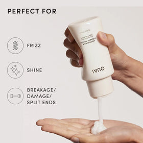 OUAI medium conditioner being applied to hands showing slip and spreadability