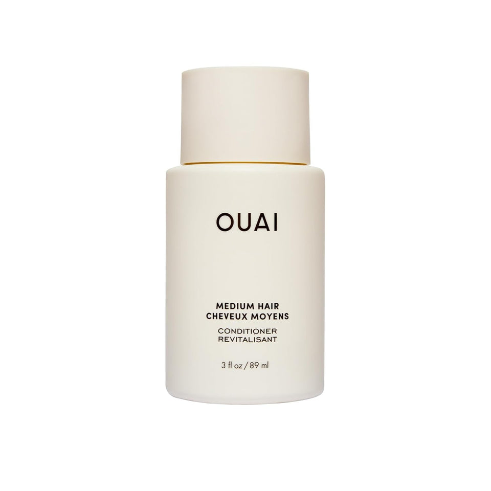 OUAI medium conditioner front packaging showing bottle and logo for brand recognition and travel convenience