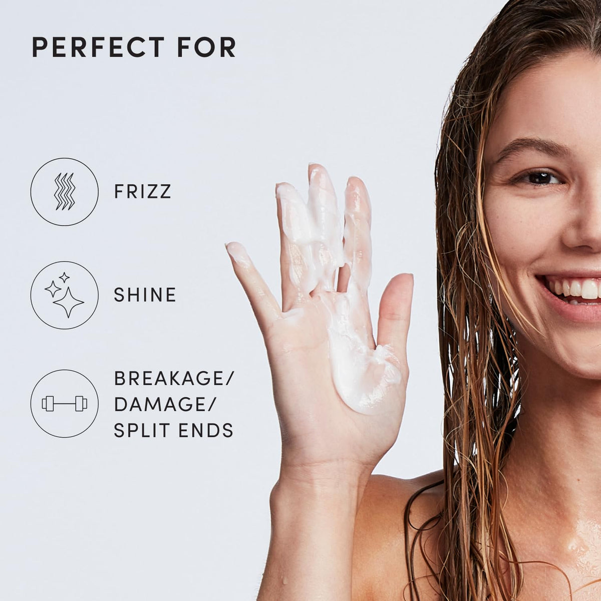 OUAI medium conditioner held in hand to show 10 oz size and travel-friendly scale