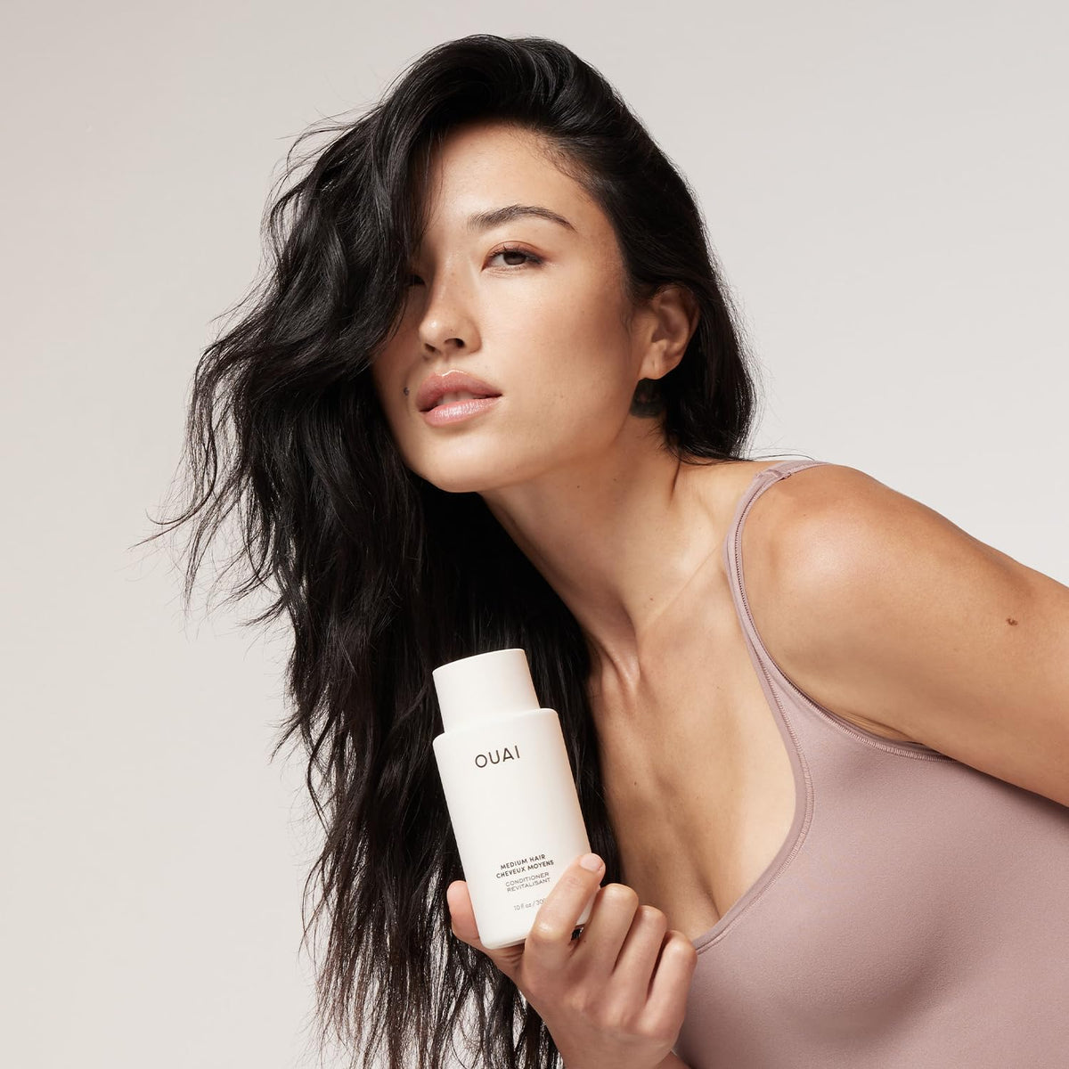 OUAI medium conditioner kumquat ingredient close-up highlighting natural shine boost