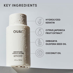 OUAI medium conditioner open cap showing creamy formula for smoothing frizz