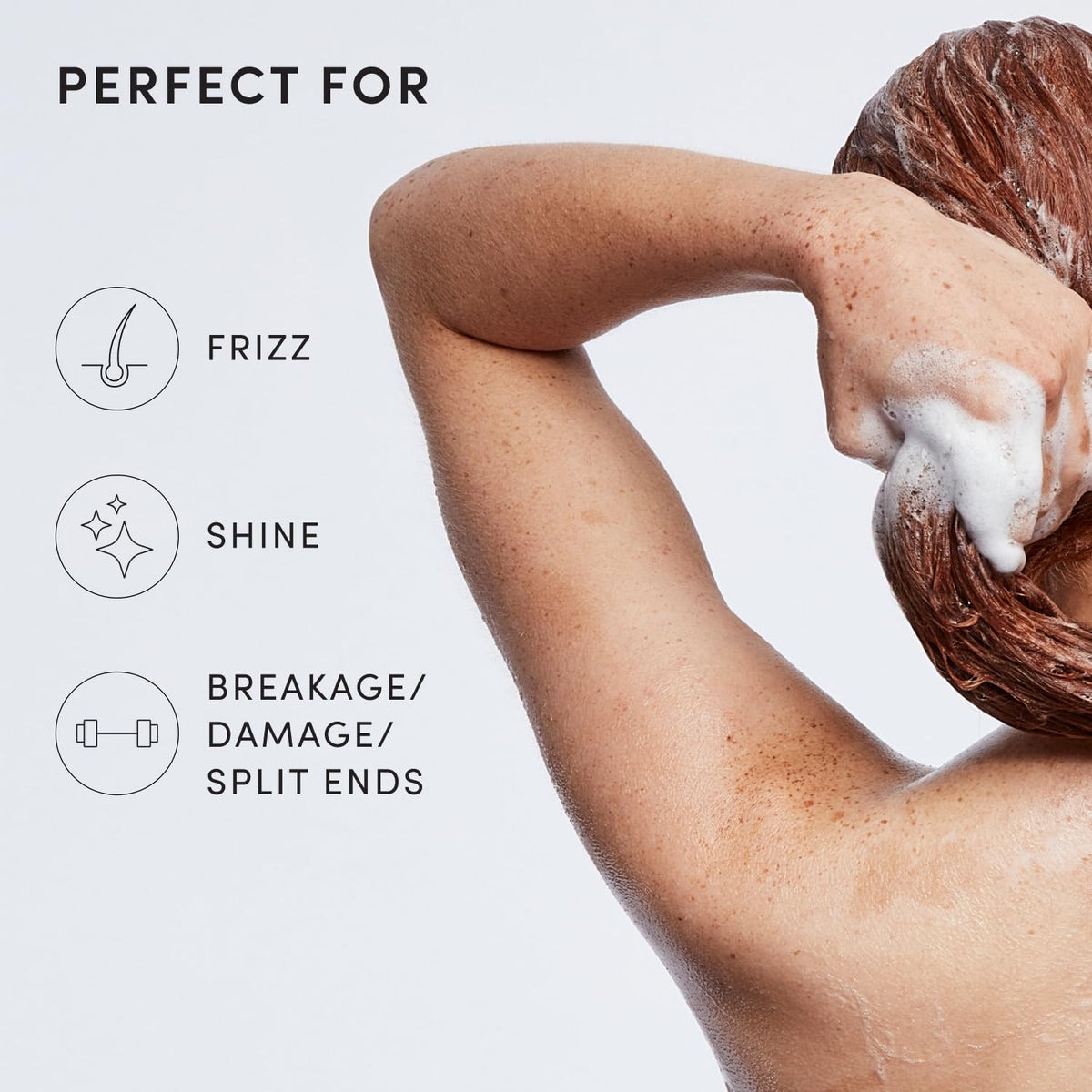 OUAI medium shampoo bottle alongside coconut and babassu, communicates nourishing oil benefits