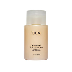 OUAI medium shampoo front packaging showing travel bottle and branding benefit portable cleansing
