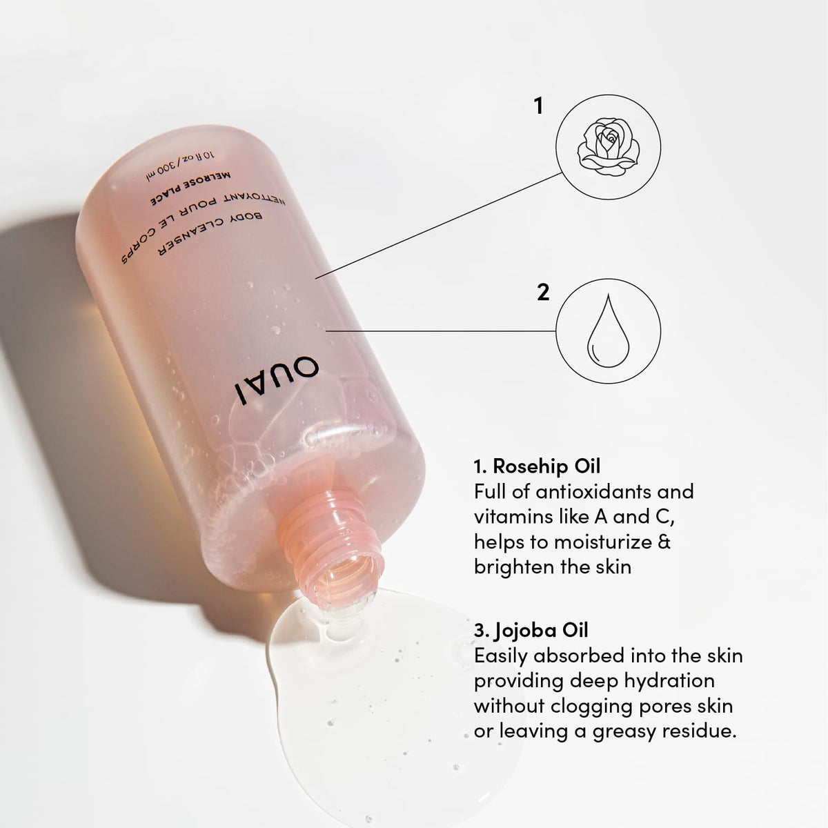 OUAI foam texture on hand displaying creamy suds and hydrating feel from jojoba oil