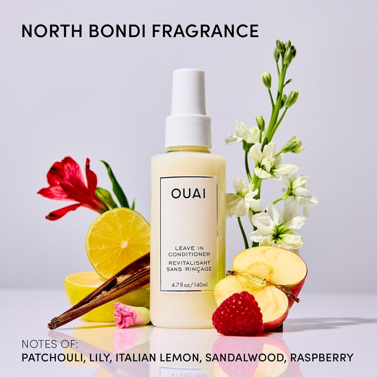 OUAI bottles held in hand for scale, shows full and mini size clarity