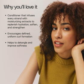 Ouidad conditioner being applied in shower to hydrate and soften tight curls