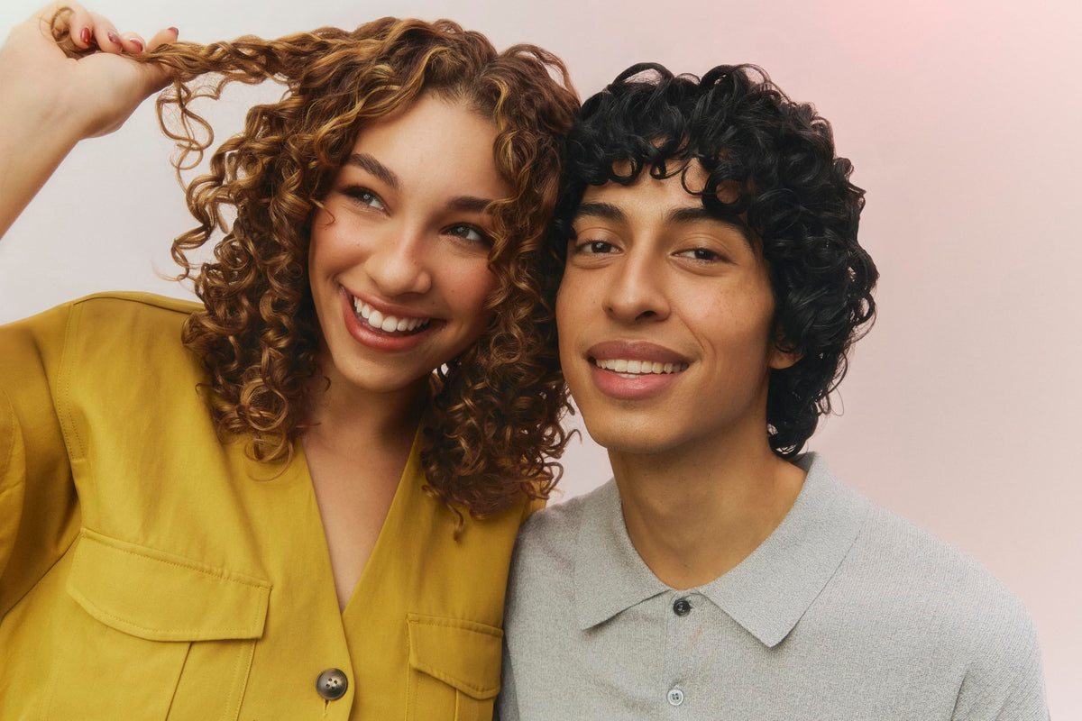 Ouidad applied to damp wavy hair showing enhanced definition and frizz control benefit
