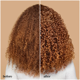 Woman with defined curls styled using Ouidad gel in everyday setting