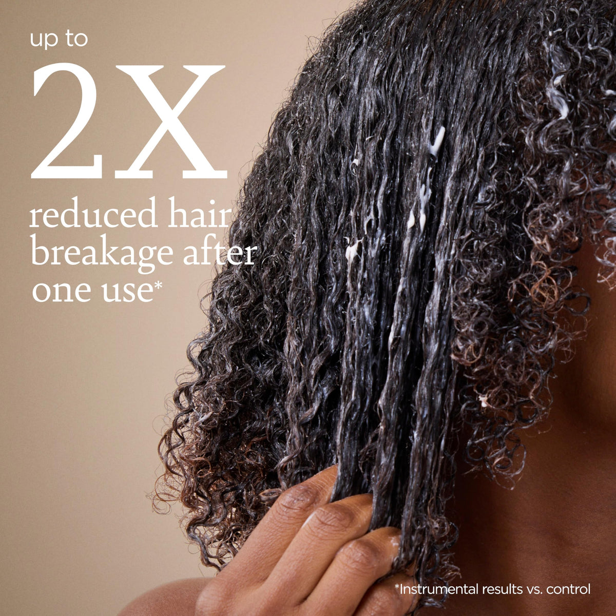 ouidad combing through midlengths demonstrating easier detangling benefit