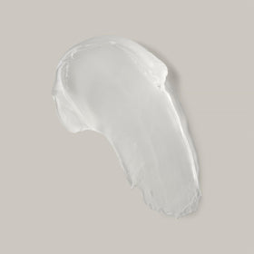 Ouidad pomade texture close-up showing clear smooth formula for flake-free hold