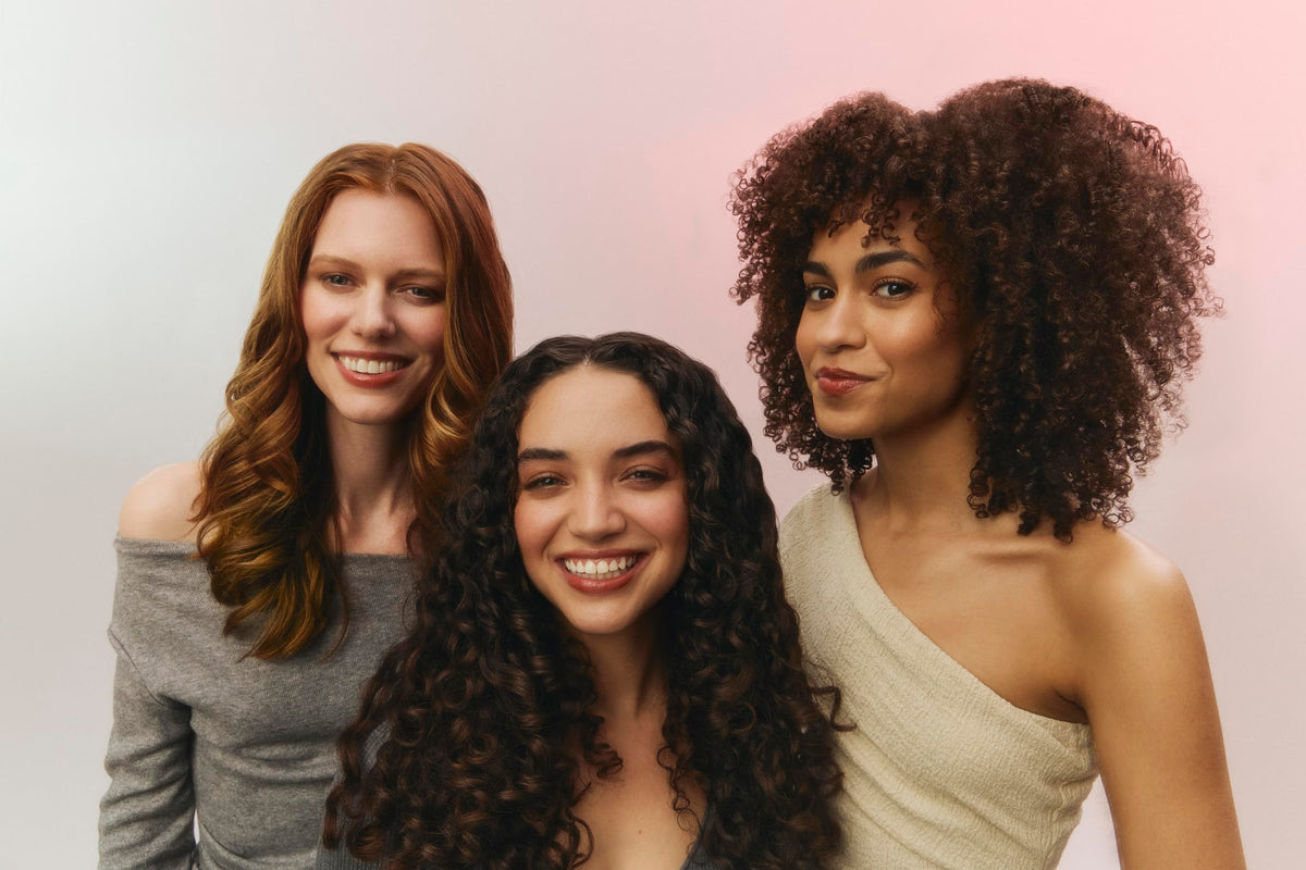 Ouidad label with sericin and ingredient callouts highlighting anti-frizz protection