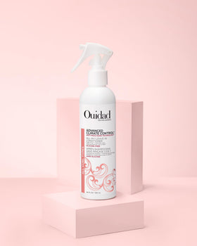 Product on bathroom shelf in styled setting showing Ouidad daily routine benefit