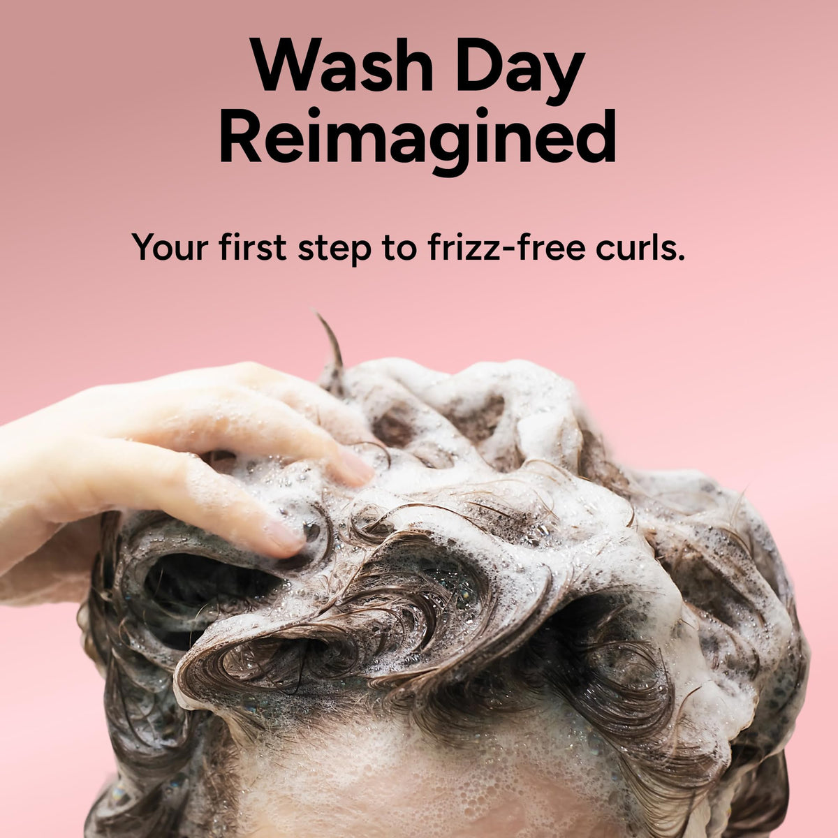 Ouidad styled curly hair in lifestyle shot showcasing defined, healthy-looking curls