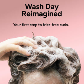 Ouidad styled curly hair in lifestyle shot showcasing defined, healthy-looking curls