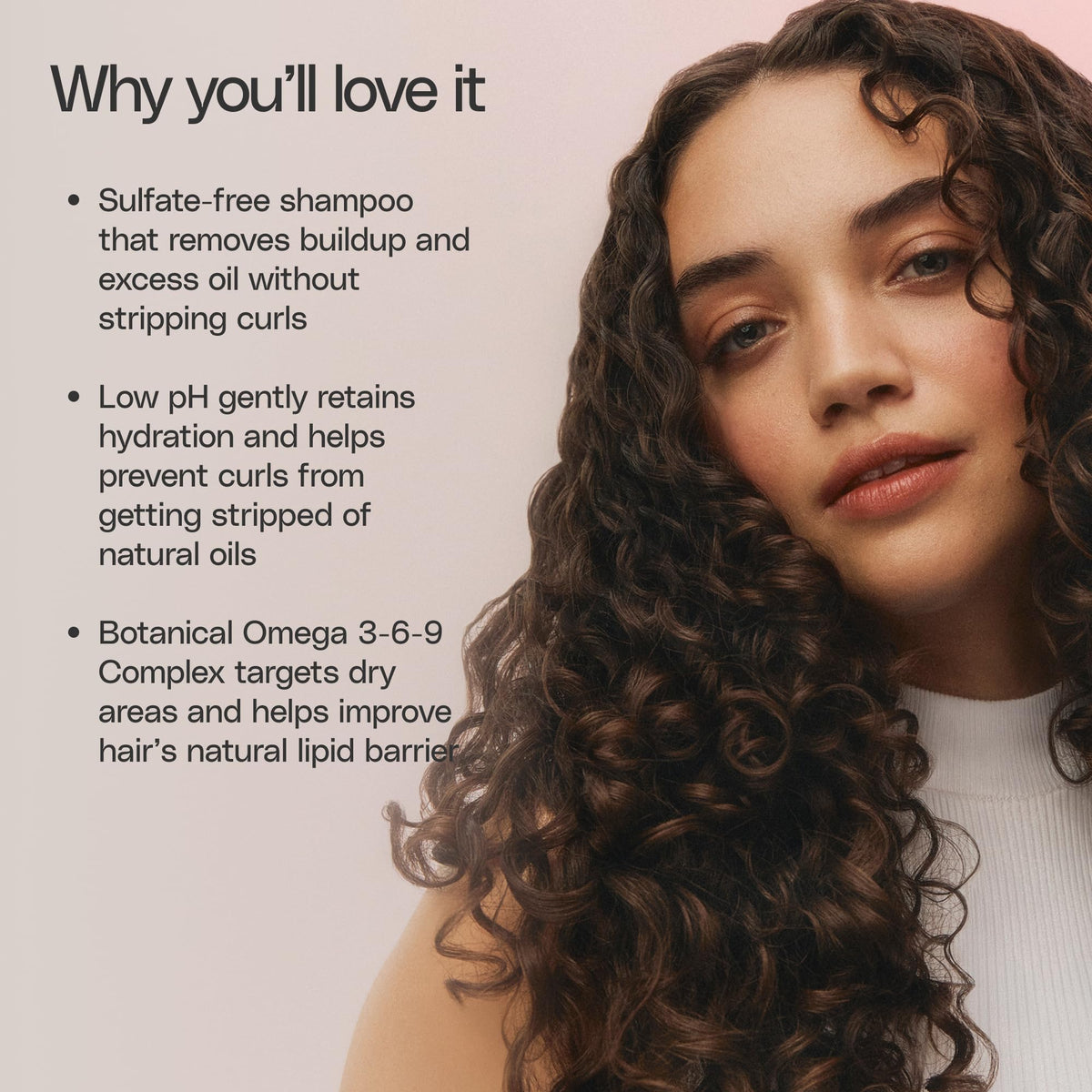 Ouidad bottle in shower with curly hair demonstrating improved curl definition