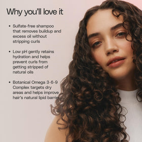 Ouidad bottle in shower with curly hair demonstrating improved curl definition