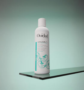 Ouidad VitalCurl pump dispenser close-up for easy, mess-free application