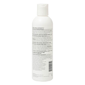 Close-up of Ouidad Water Works shampoo lather and texture demonstrating gentle cleanse