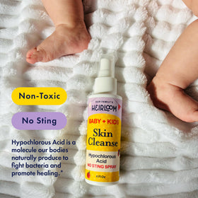 Our Family's Heirloom 4 oz size next to diaper bag to show travel convenience