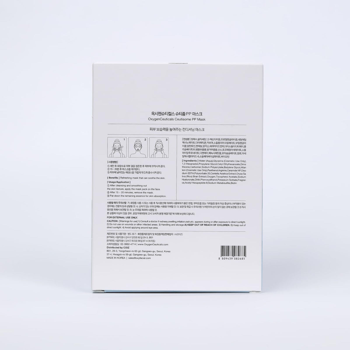 Hand holding OxygenCeuticals mask to show scale and single-use size