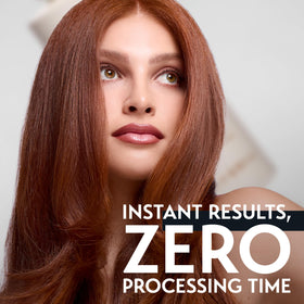 OYA conditioner in hand being applied to mid-lengths for hydration