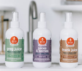 Oyin Handmade Greg Juice mist being sprayed on curls to hydrate and refresh styles