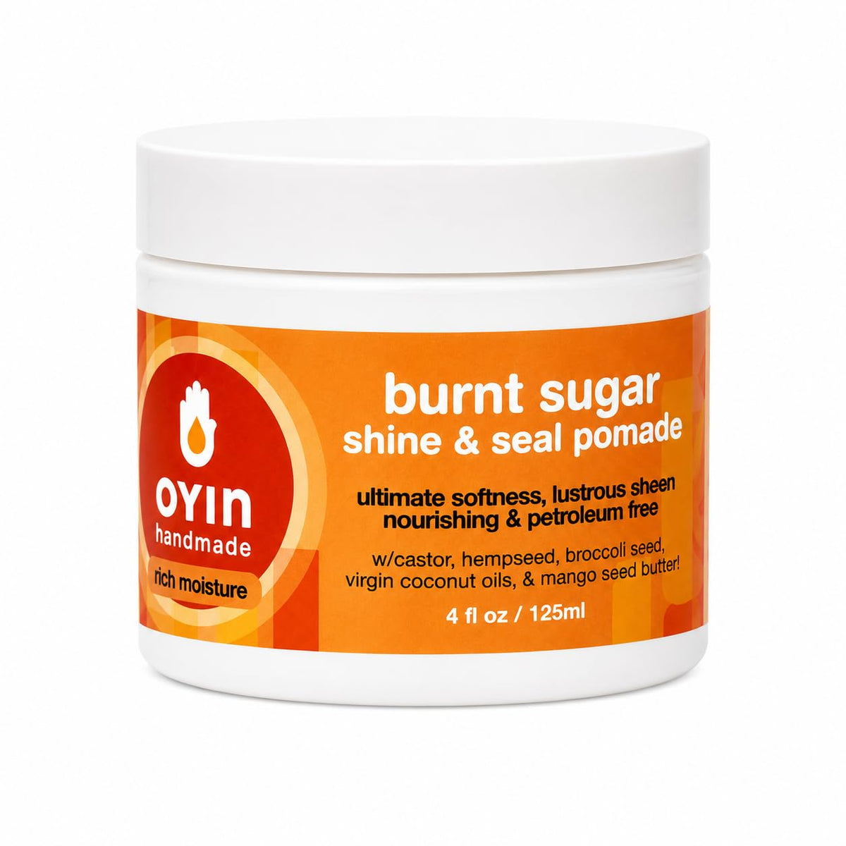 Oyin Handmade Burnt Sugar Pomade jar front view showing label and packaging, highlights brand clarity and portability
