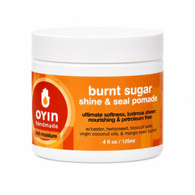 Oyin Handmade Burnt Sugar Pomade jar front view showing label and packaging, highlights brand clarity and portability