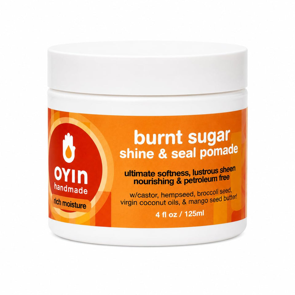 Oyin Handmade Burnt Sugar Pomade jar front view showing label and packaging, highlights brand clarity and portability
