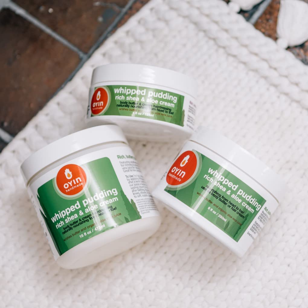 Oyin Handmade applied in hair demonstrating moisturized defined curls benefit