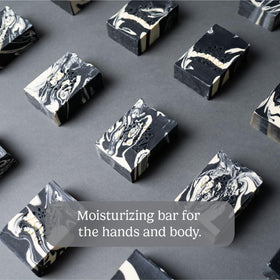 Pacha Soap Co close-up texture of charcoal soap revealing creamy lather benefit