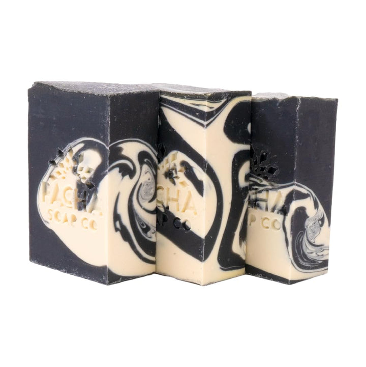 Pacha Soap Co front packaging showing charcoal bars and branding benefits