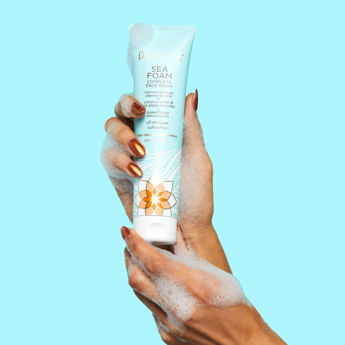 Pacifica Sea Foam bottle held in hand showing size and travel convenience