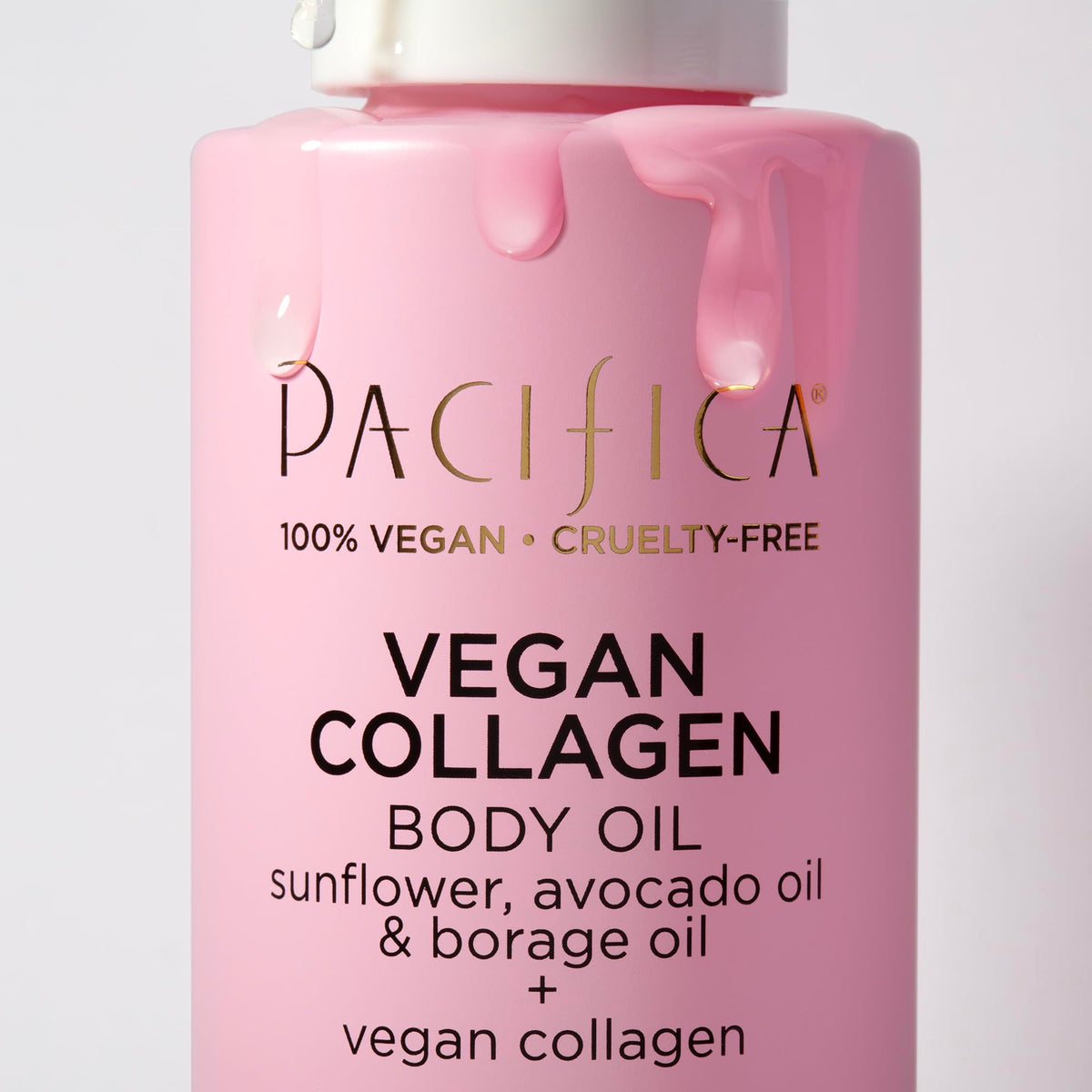 Pacifica 4 fl oz oil next to hand for size and usage clarity